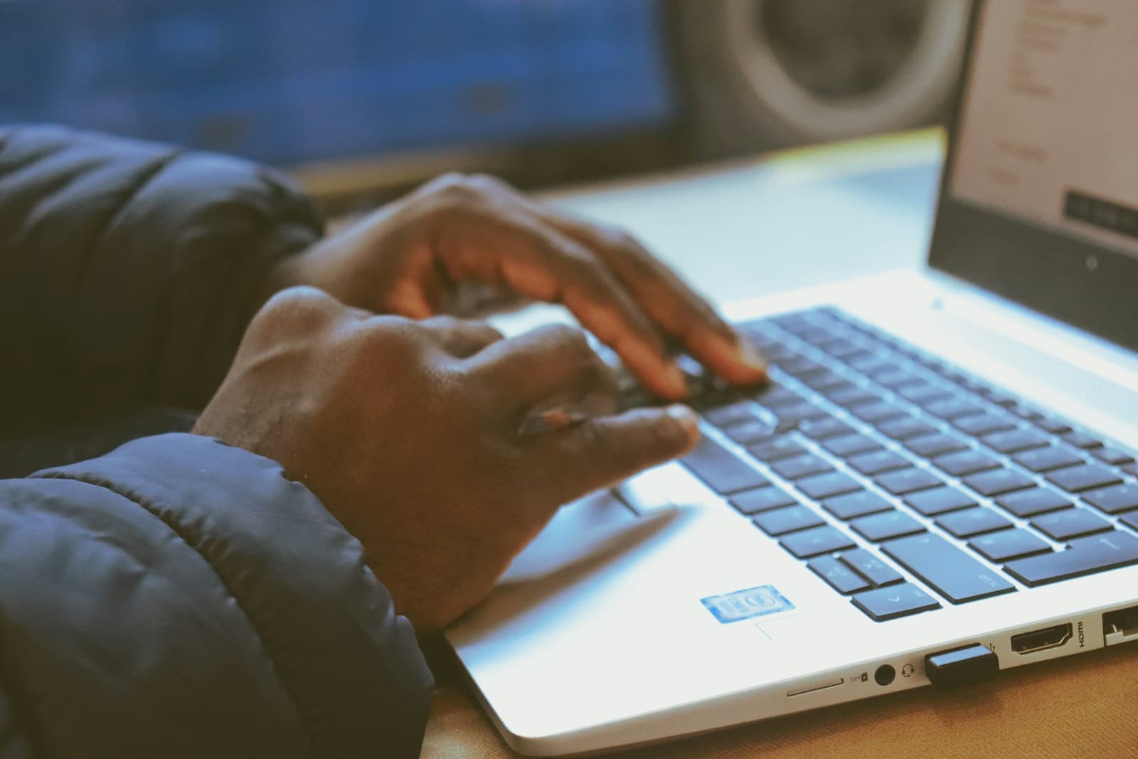 African hands typing an idea into a laptop