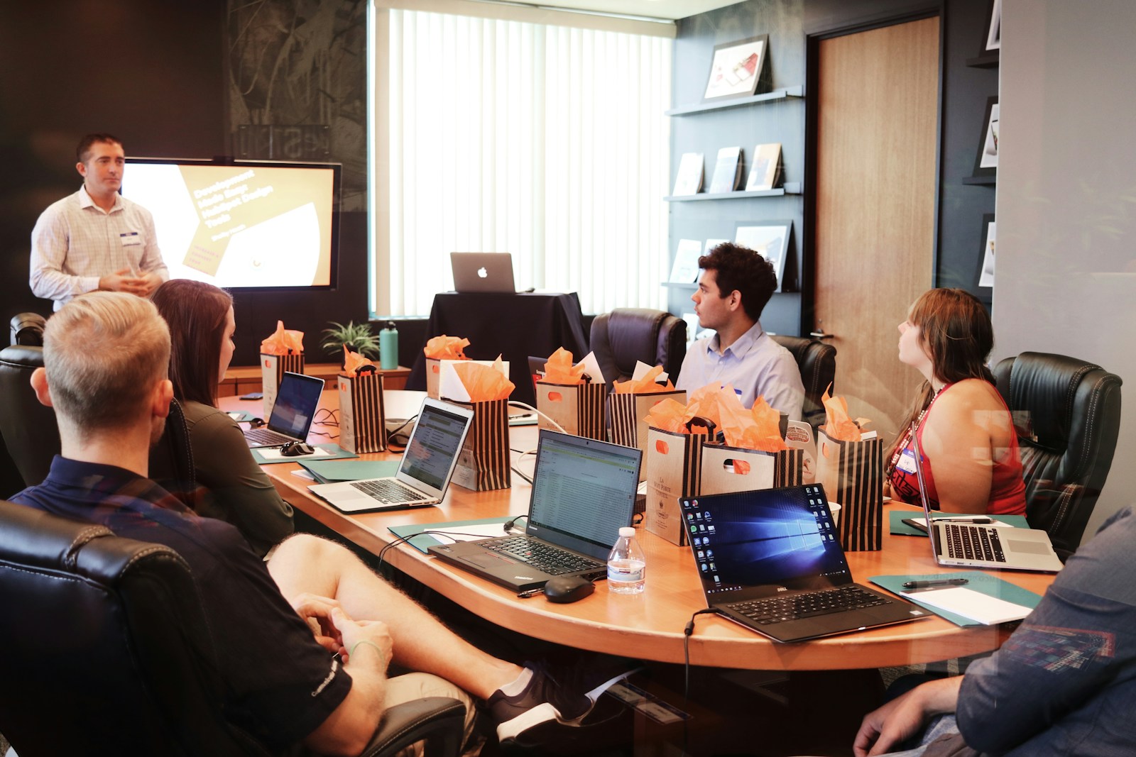 Team reviewing notes together around a conference table